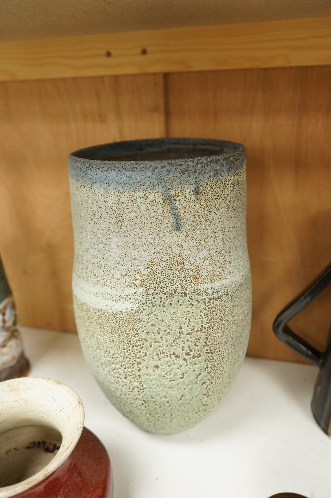 A group of eleven pieces of mixed 1960's-80's pottery to include vases, jugs and two rectangular dishes, largest 34cm high